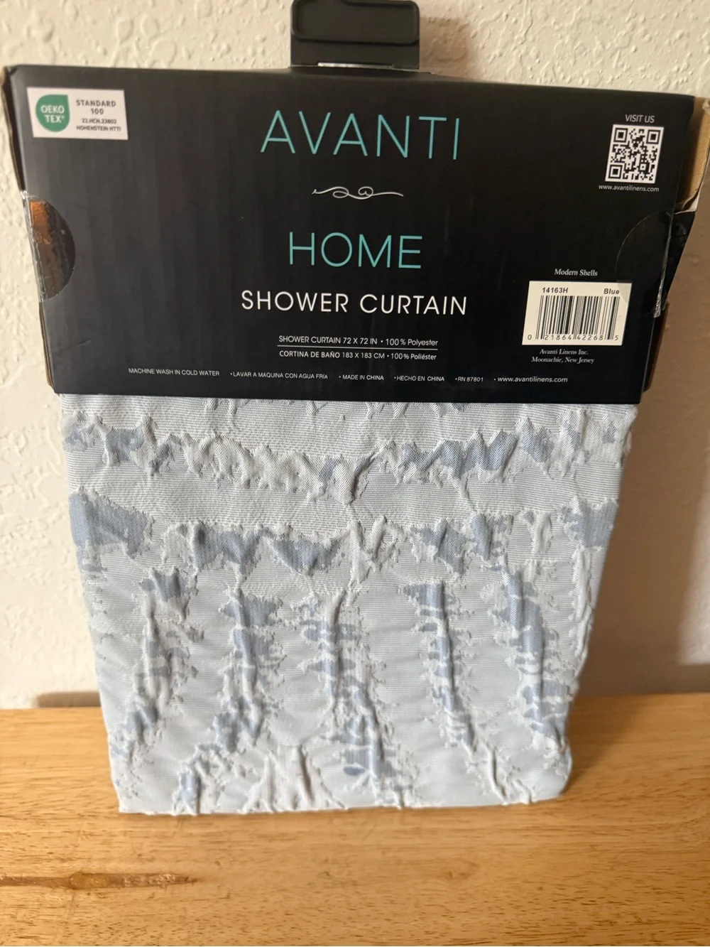 Avanti Modern Shells Shower Curtain in Light Blue.
